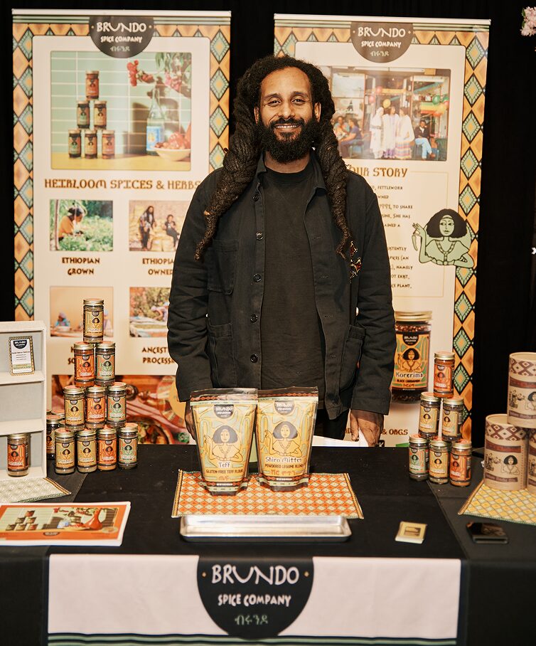 Vendor standing at the Brundo Spice Company booth